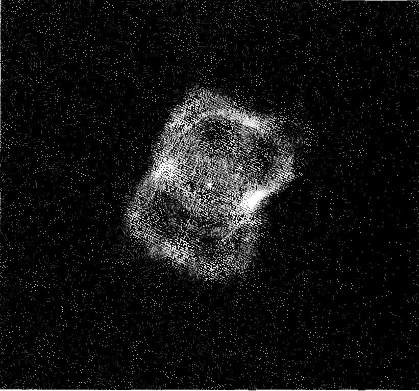 Figure 10.10. The contours show NGC 7027 in the 6-cm radio continuum, and so is an extinction-free image of the H^+ zone. The gray-scale image shows the H_2 1-0 S(1) 2.12- \mu m emission. The H_2 emission comes from the region just outside the H^+ ionization front.