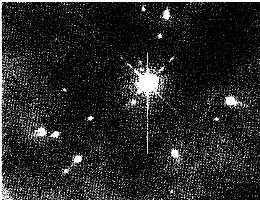 Figure 6.3. Inner regions of the Orion Nebula seen in the light of Hα . This 26 \times 18 arcsec HST image shows the region centered at \theta^1 Ori C, the bright star. Each condensation is irradiated by the central star, producing a flow of ionized gas that interacts with \theta^1 Ori C's stellar wind.